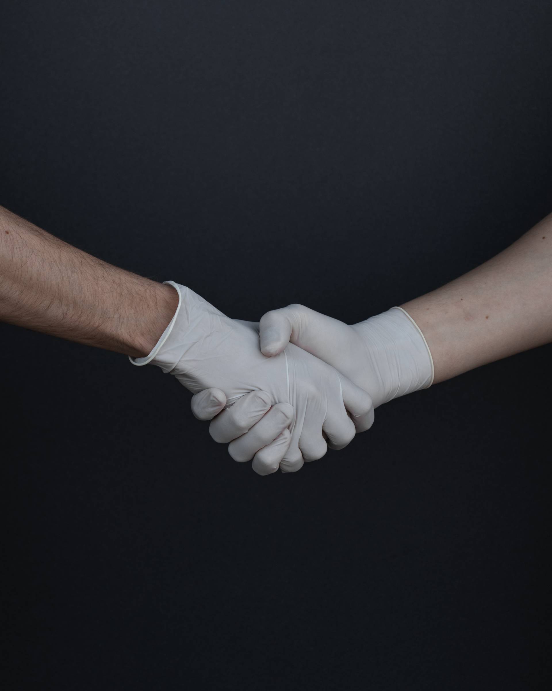 people-shaking-hands-in-latex-gloves-3959482-1