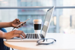 person-using-macbook-air-on-table-1181248-1